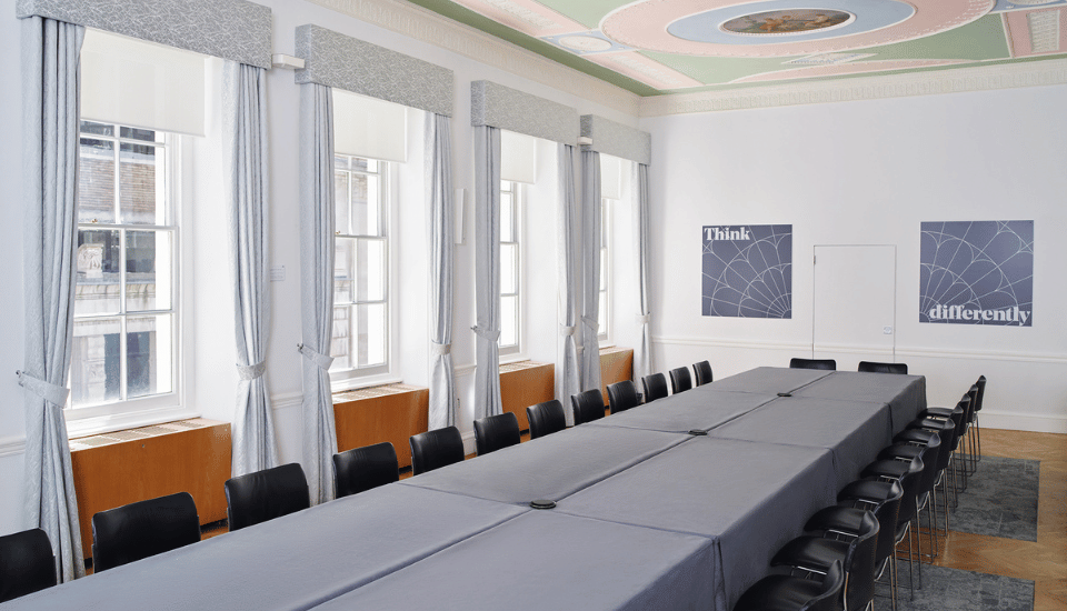 Image of the Prince Philip Room with furniture arranged in a boardroom style.