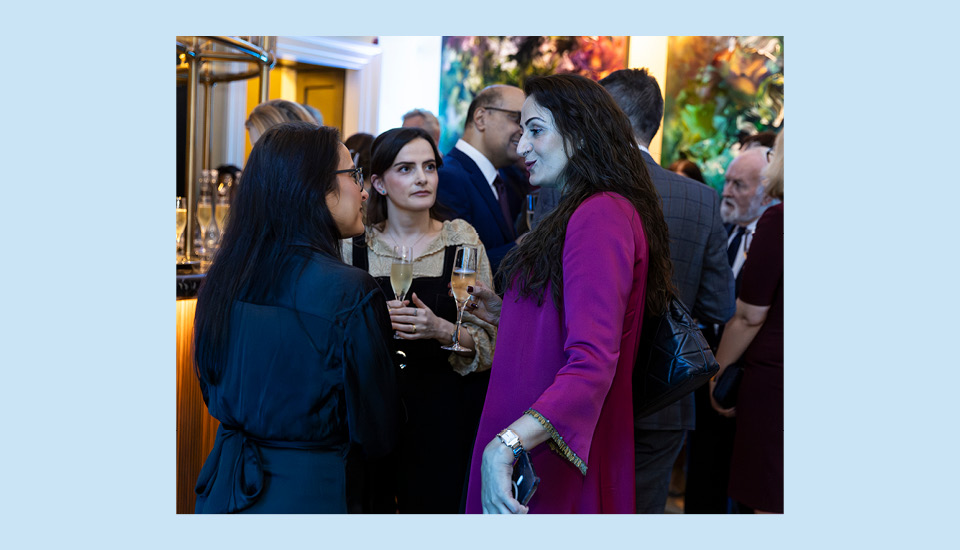 A photo of Syima Aslam in conversation at the newly opened Muse at RSA House bar.